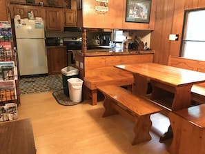 Enjoy casual meals at the kitchen table or bench, with a refrigerator and microwave nearby.