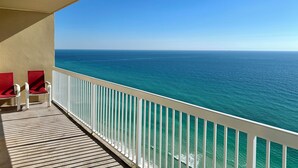 A balcony with a view of the ocean.