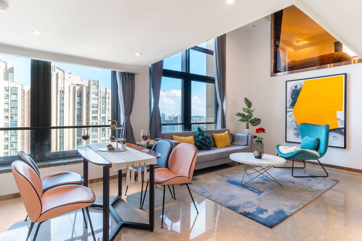 Riverside Three-bedroom Suite Duplex | Living area | Flat-screen TV