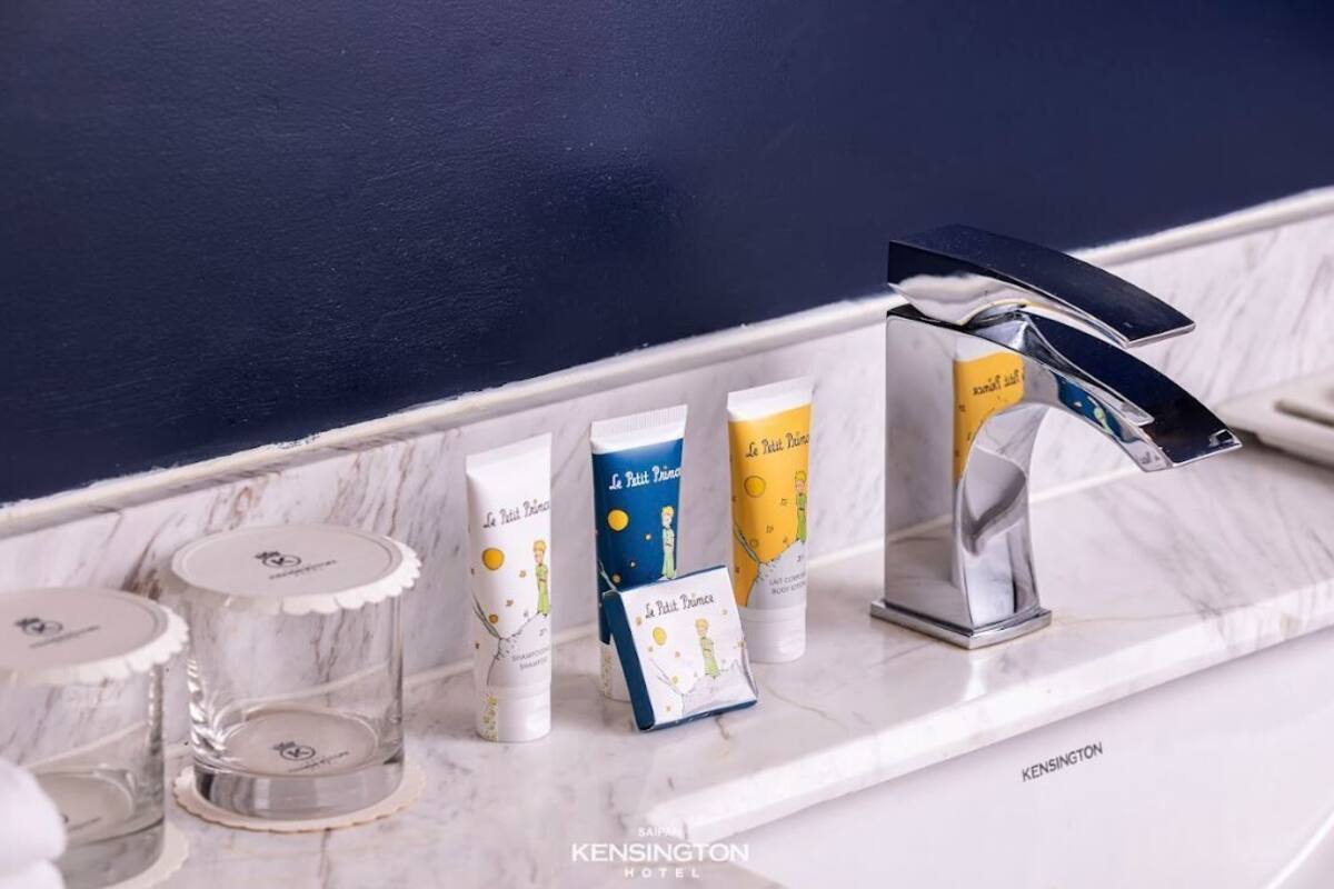 twin room, ocean view | bathroom | rainfall showerhead, designer toiletries, hair dryer, bathrobes