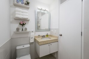 Combined shower/tub, hair dryer, towels, soap