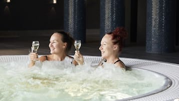 Relax and unwind in our hot tub, perfect for socializing and leisure.