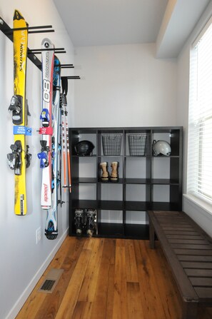 A ski storage area with skis, helmets, and boots. - Beautiful 5 bedroom + sleeping loft ski-in/ski-out Mountain House (Granby)