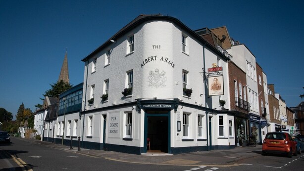 A white building with "The Albert Arms" sign, indicating a pub with dining rooms.
