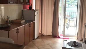 Studio, Balcony | Private kitchen | Coffee/tea maker, fridge, stovetop, electric kettle - Apartments Ivanisevic (Kotor)