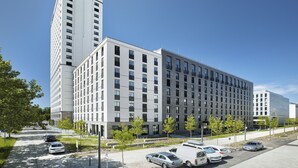 A modern multi-story building with a parking lot in front. - BD Munich Olympiapark (Munich)