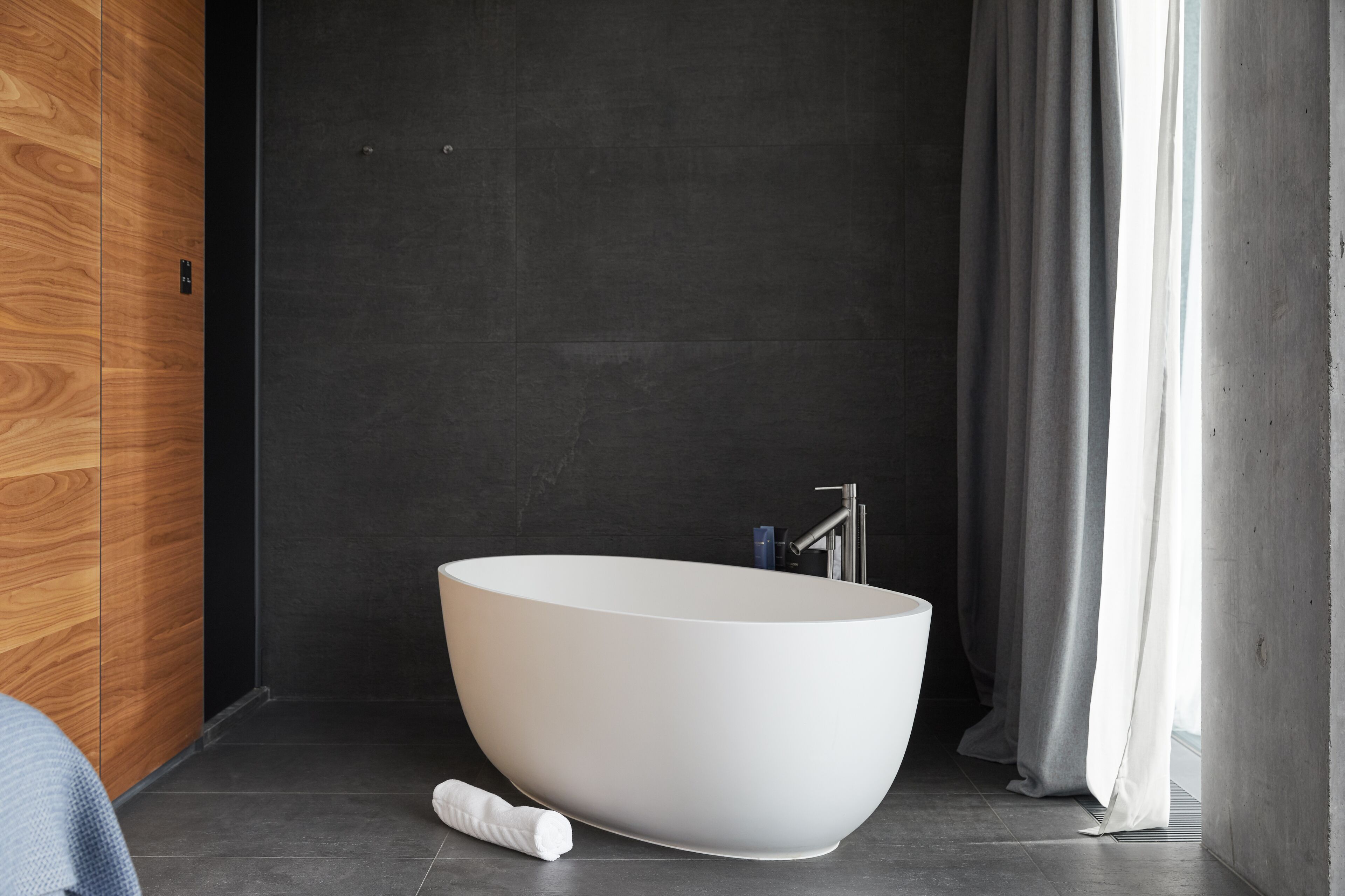 designer toiletries, hair dryer, bathrobes, slippers