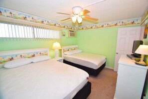 A room with two beds, a ceiling fan, a TV, and a desk with a lamp. - Beachmark 3F - 1 Bedroom Condo by RedAwning (Ocean City)