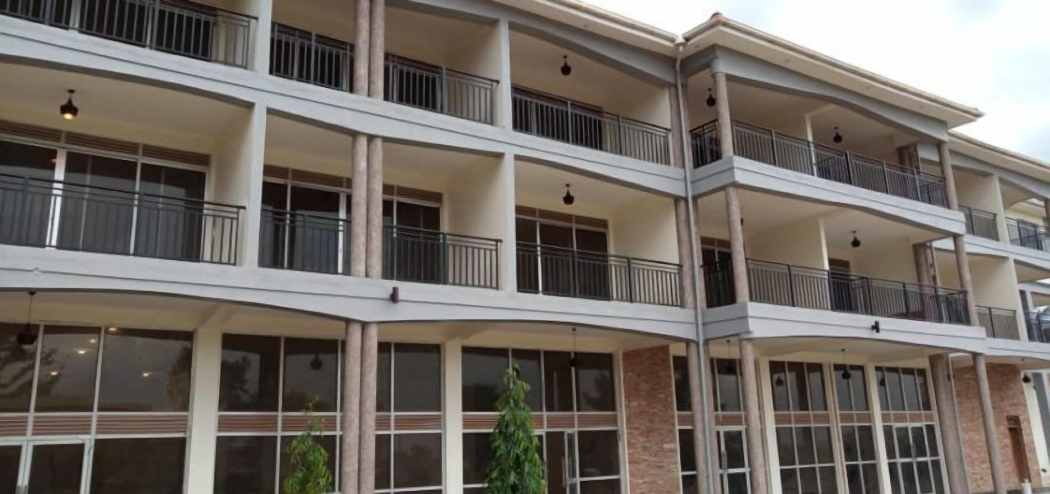 A multi-story hotel with balconies, large windows, and a modern architectural design.