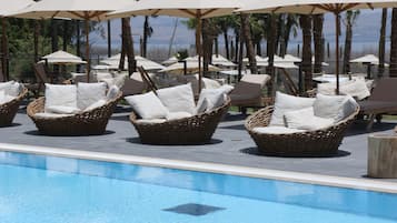 Indoor pool, outdoor pool, open 9:00 AM to 6:00 PM, pool umbrellas