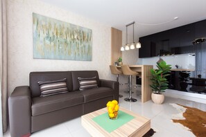 Apartment, 1 Bedroom | Living area | Flat-screen TV