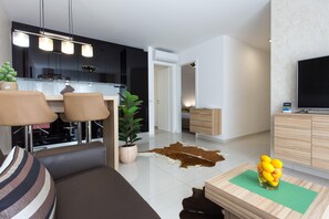 Apartment, 1 Bedroom | Living area | Flat-screen TV
