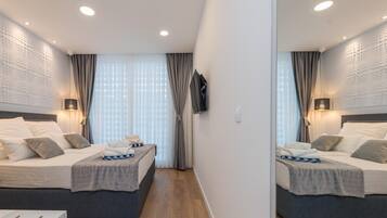 Desk, blackout drapes, soundproofing, free cribs/infant beds
