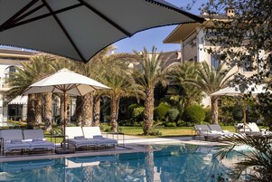Outdoor pool, open 11:00 AM to 6:00 PM, pool umbrellas, sun loungers