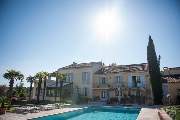 Outdoor pool, open 8:30 AM to 8:30 PM, pool umbrellas, pool loungers