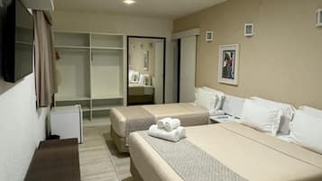 Quadruple Room, Multiple Beds, Non Smoking | Minibar, blackout drapes, iron/ironing board, bed sheets