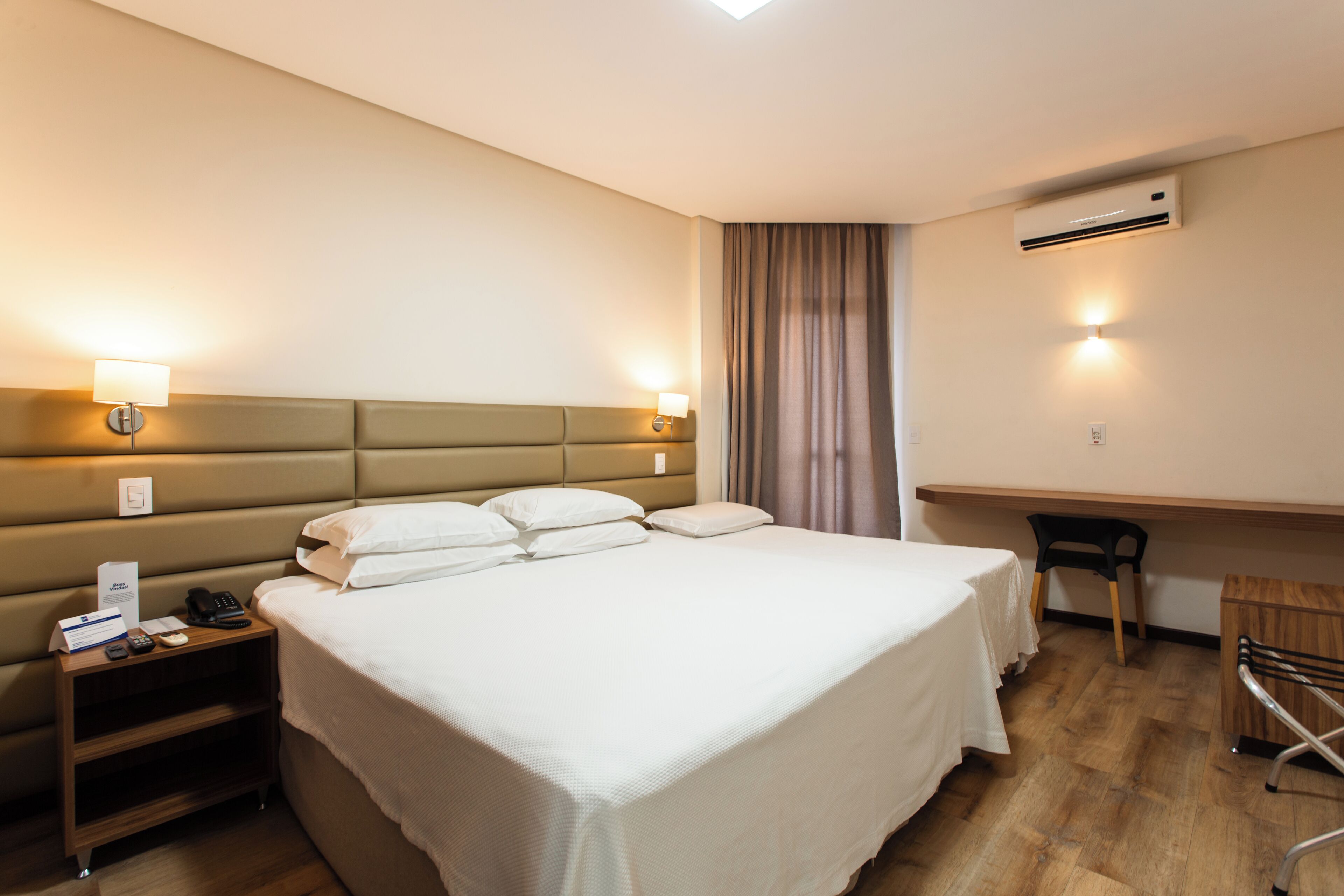 Deluxe Triple Room | Minibar, laptop workspace, blackout drapes, free WiFi
