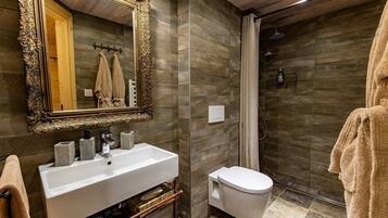 Bathtub, hair dryer, towels, soap