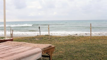 On the beach, sun loungers, beach towels