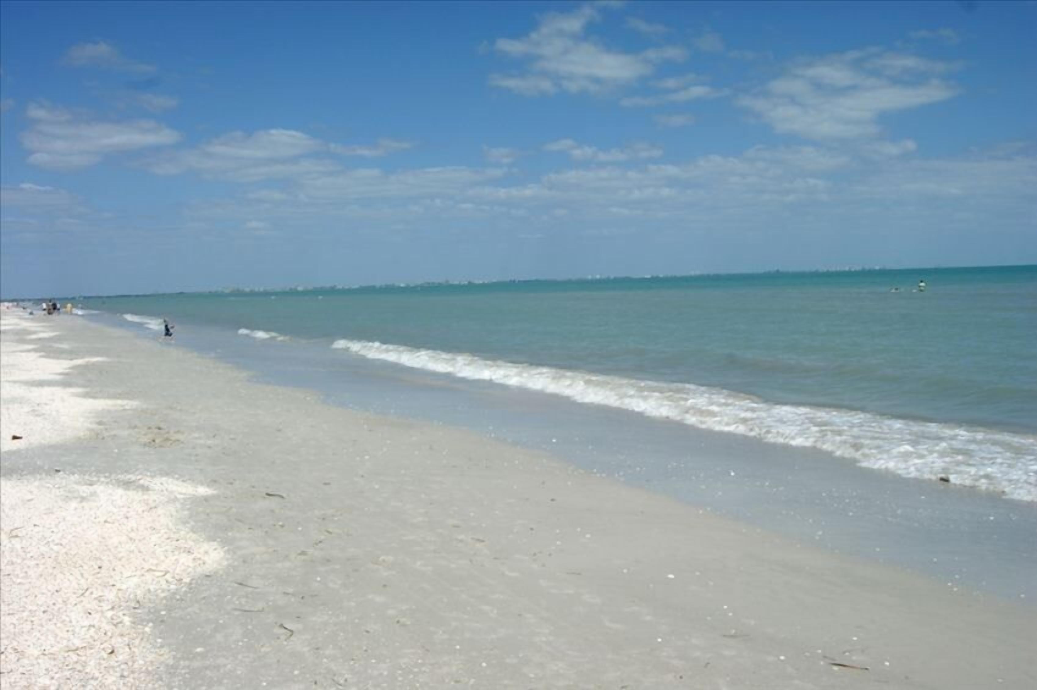 On the beach, sun loungers, beach towels