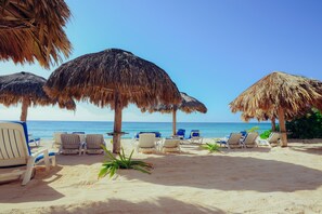 On the beach, sun-loungers, beach towels