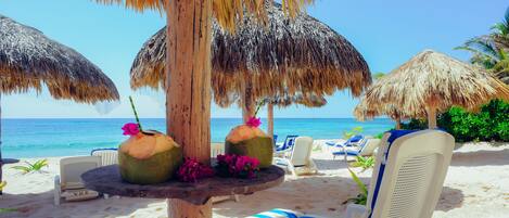 On the beach, sun-loungers, beach towels