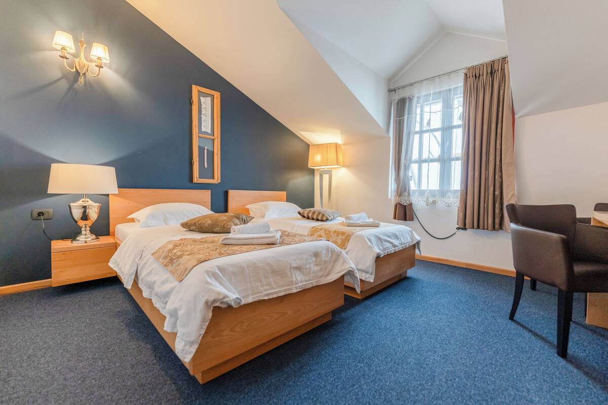 comfort room, 2 single beds, city view | minibar, in-room safe, desk, blackout curtains