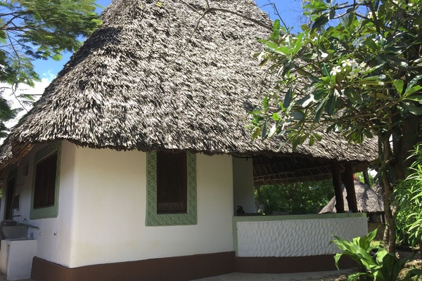 The Cottage side view with traditional laundry area