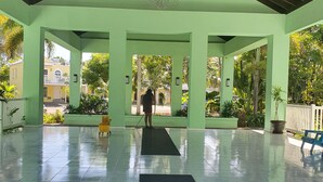 A spacious indoor area with a green ceiling and a chandelier. - Family friendly Townhouse by the Bay , private Beach & Pool , Negril  (Negril)