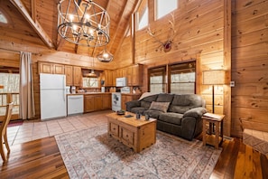 Cozy living area with a comfortable sofa and wooden coffee table, perfect for relaxing.