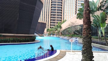 3 outdoor pools, open 6:00 AM to 10:00 PM, pool umbrellas