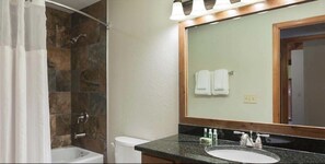 Deluxe Villa, 1 Bedroom, Kitchen | Bathroom | Combined shower/bathtub, hair dryer, towels