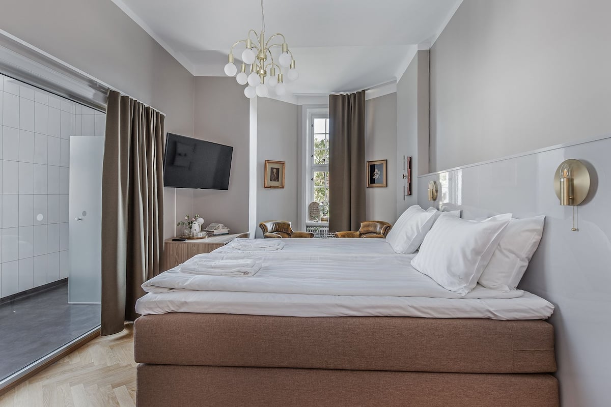 grand room | 1 bedroom, individually decorated, desk, blackout curtains