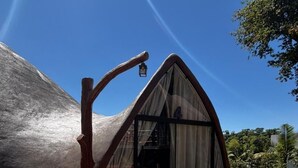 A unique tent-like structure with a wooden entrance and a number '4' sign, surrounded by a wooden fence and a clear sky. - Aj Termas Hotel Iraí (Irai)