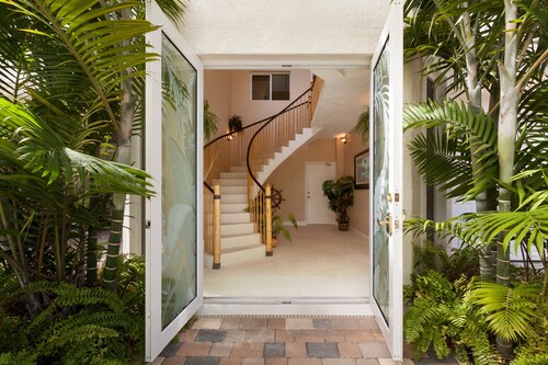 5BR luxury home w/ pool, theater, rooftop deck & 100-ft dock near beach!