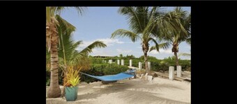 5BR luxury home w/ pool, theater, rooftop deck & 100-ft dock near beach!