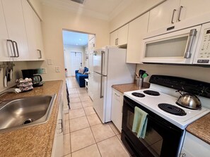 A modern kitchen with stainless steel appliances, a microwave, and a stove. - Two Bedroom Retreat Near Deerfield Beach Pier (Deerfield Beach)