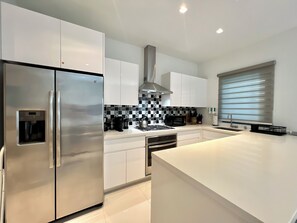 Microwave, dishwasher, coffee/tea maker, cookware/dishes/utensils