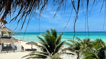 On the beach, sun loungers, beach towels