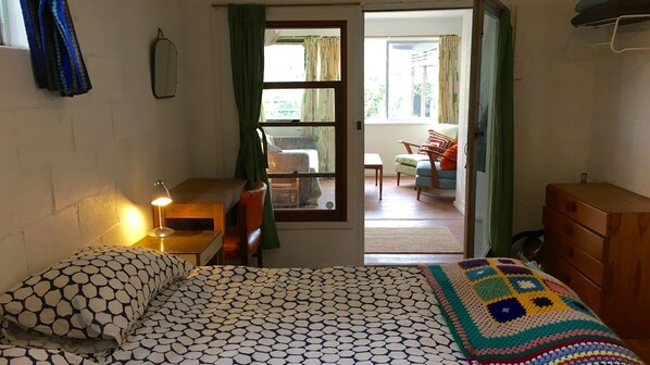 A bedroom with a bed, a desk, a chair, and a window. - Lemon Tree Shack - Family friendly by the sea (Lemon Tree Passage)