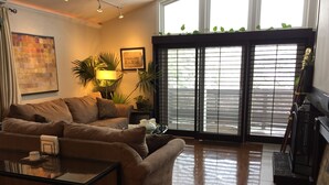 A living room with a sofa, coffee table, and a fireplace. - Experience a Relaxing Retreat at Lookout Mountain Lodge (30 Day Min) (Golden)