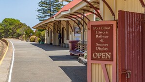 A historic railway station with a sign indicating 'Port Elliot Historic Railway & Seaport Display OPEN'. - Pet Friendly in Port Elliot (Port Elliot)