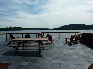 Outdoor dining - Stunning timber frame lake house with boathouse, game room. Sleeps 10. (Tupper Lake)