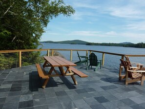 Outdoor dining - Stunning timber frame lake house with boathouse, game room. Sleeps 10. (Tupper Lake)