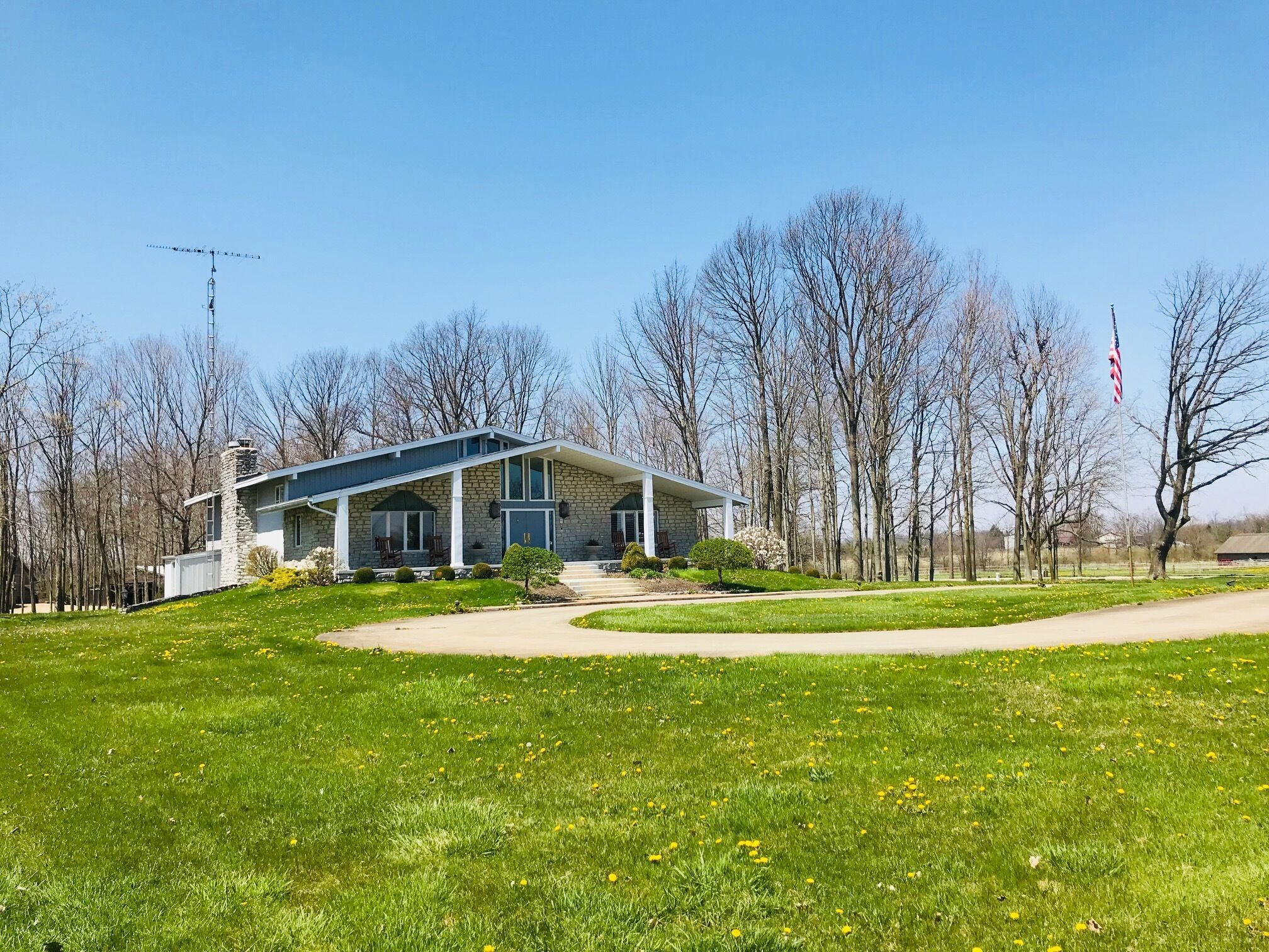 Circle drive leading to large front porch to enjoy views of the farm.