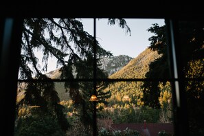 Enjoy breathtaking views of the surrounding mountains and lush trees from the comfort of your room.
