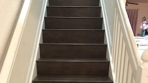 A staircase with dark wooden steps and white railings. - Updated Furniture, 2 Miles To Disney, 3 BD, 3 BA, Private Pool, 5 Stars Resort, (Kissimmee)