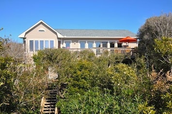 View of house from end of private boardwalk to beach.