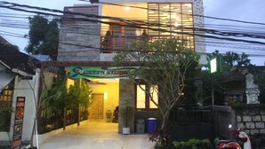 A two-story building with a sign for 'Green Studio' at the entrance. - Green Studio Seminyak (Kuta)