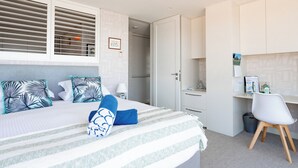 A modern bedroom with a bed, a desk, and a chair. - Balmoral Beauty - DIRECT BEACHFRONT - Romantic Studio Escape (Mosman)